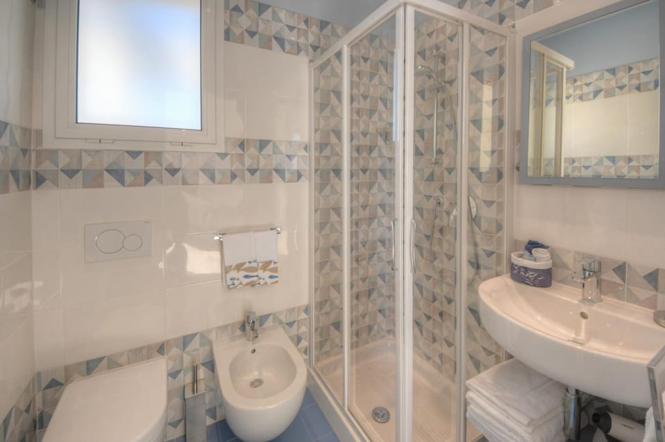 Shower, free toiletries, hair dryer, slippers