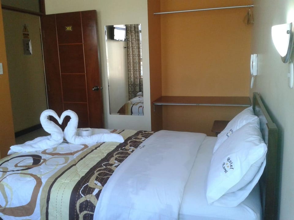 Premium bedding, blackout drapes, soundproofing, free WiFi
