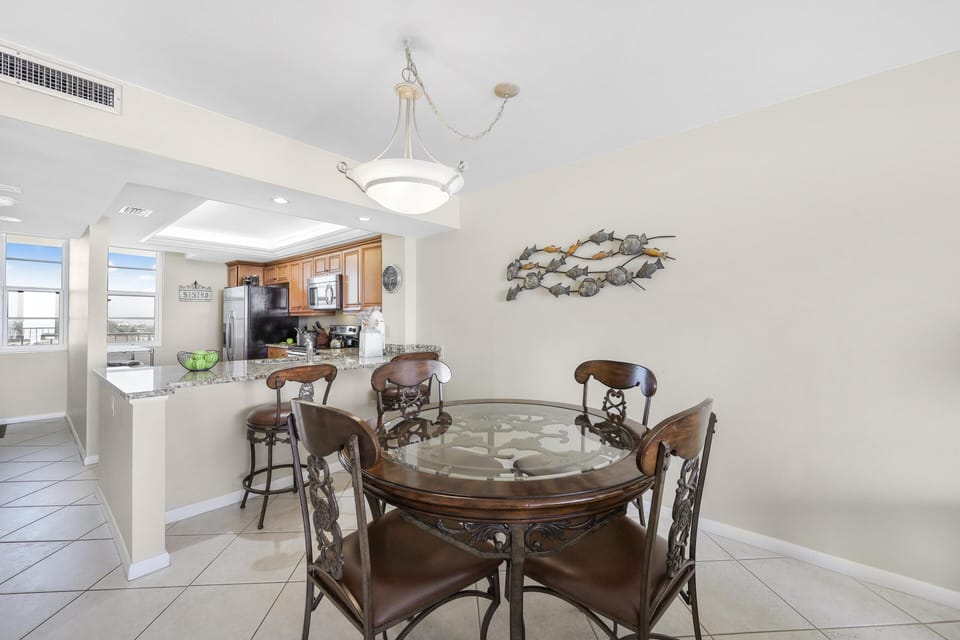 Condo, Multiple Beds (Stylish beachfront condo with pool an) | Dining