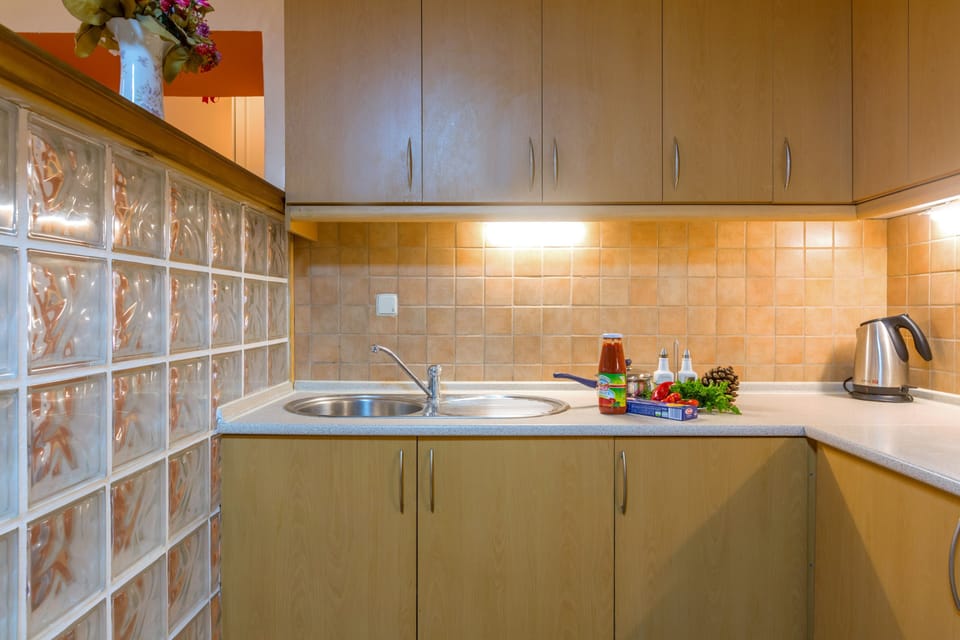 Apartment, 2 Bedrooms | Private kitchen | Full-size fridge, oven, stovetop, cookware/dishes/utensils
