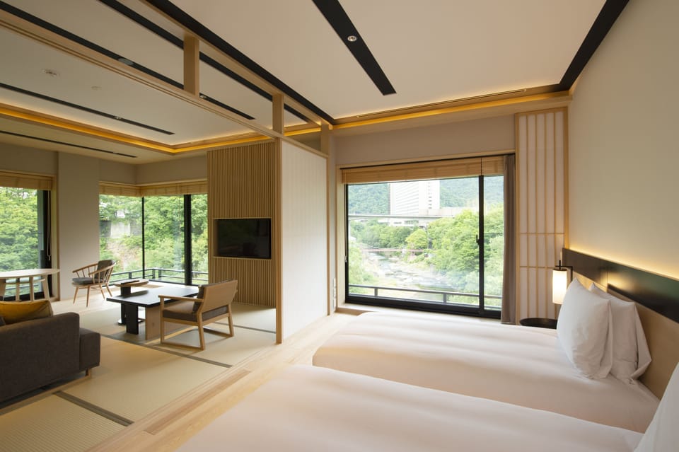 Corner Suite | Free minibar, in-room safe, blackout drapes, iron/ironing board