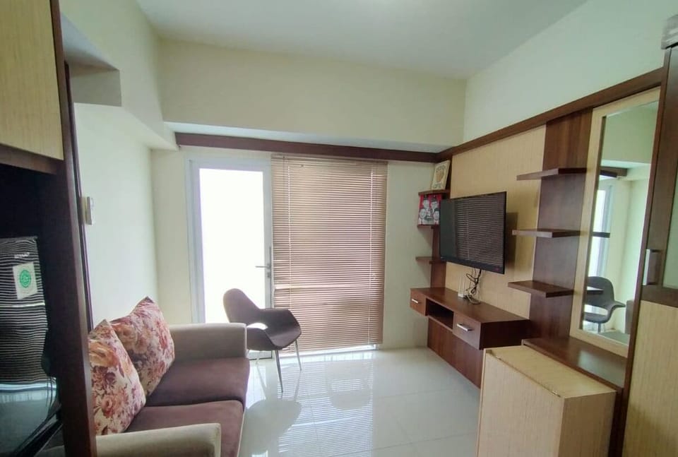 Room, 2 Bedrooms | Living area | Flat-screen TV