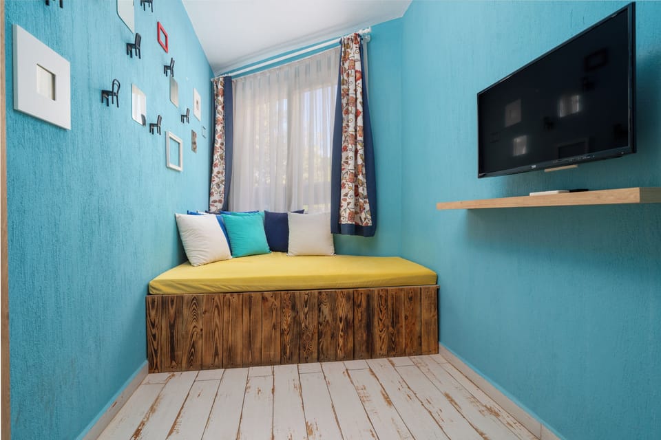 Family Quadruple Room, Garden View | 1 bedroom, in-room safe, desk, free WiFi