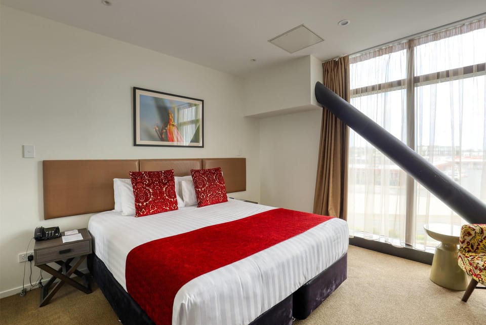 Deluxe Room, Non Smoking (Apartment) | Blackout drapes, soundproofing, iron/ironing board, free WiFi