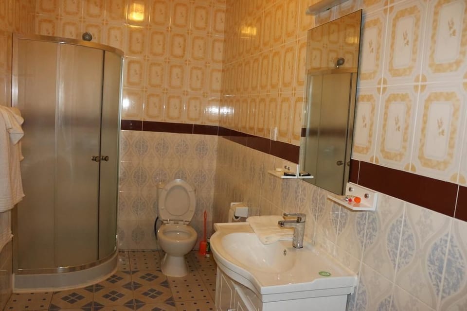 Shower, rainfall showerhead, towels, soap