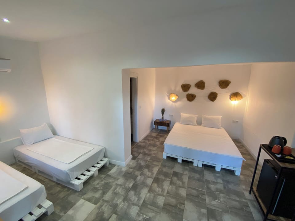 Family Quadruple Room, Multiple Beds, Garden View | Premium bedding, minibar, individually decorated, free WiFi