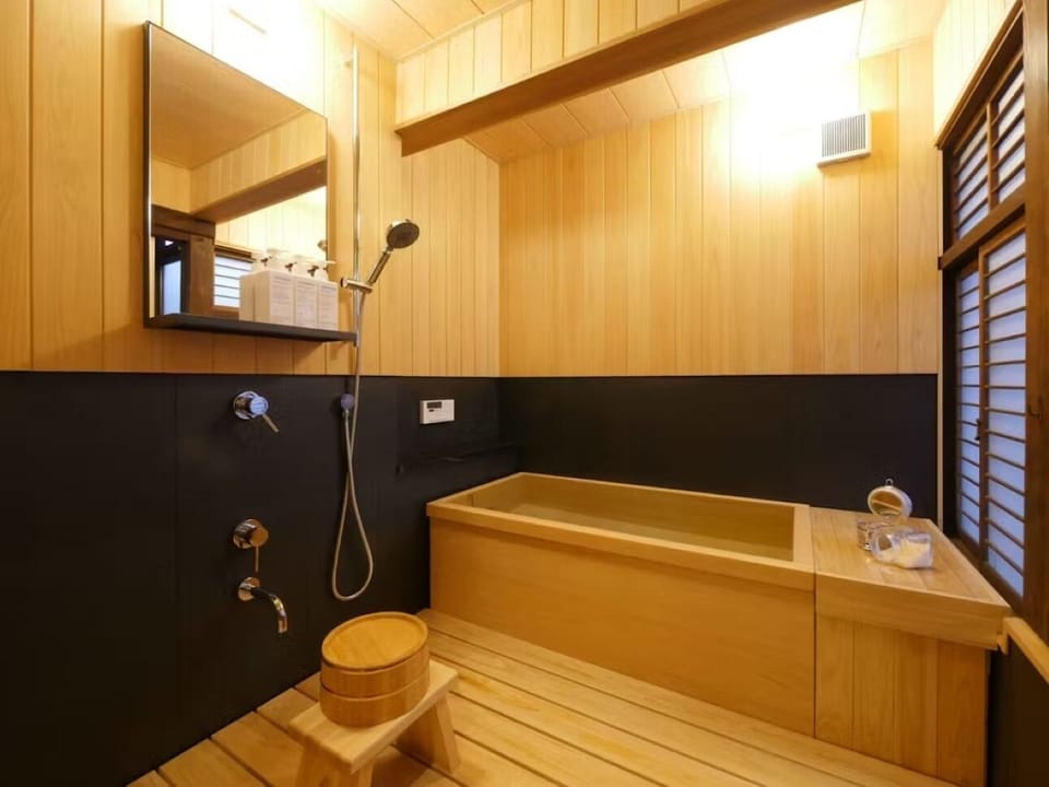 Separate tub and shower, free toiletries, hair dryer, slippers