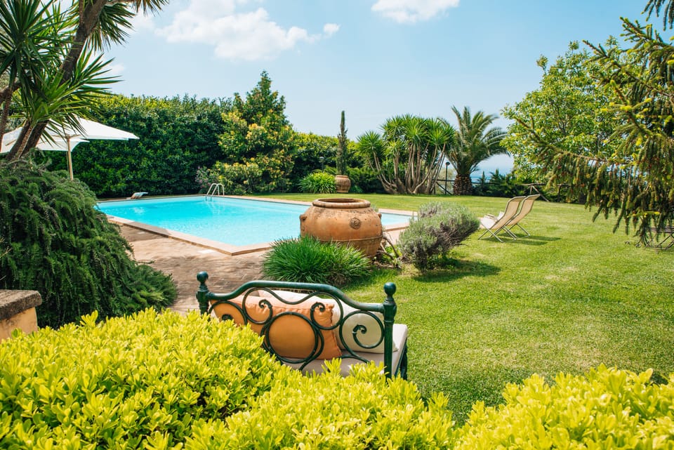 Outdoor pool, open 9:30 AM to 7:00 PM, pool umbrellas, sun loungers