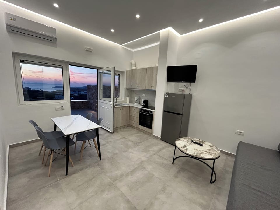 Two Bedroom Apartment with Outdoor Hot Tub Sea and Sunset View | Living area | Flat-screen TV