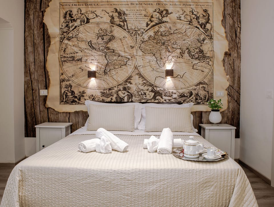 Room, Private Bathroom (Mappamondo) | Free minibar items, in-room safe, individually decorated