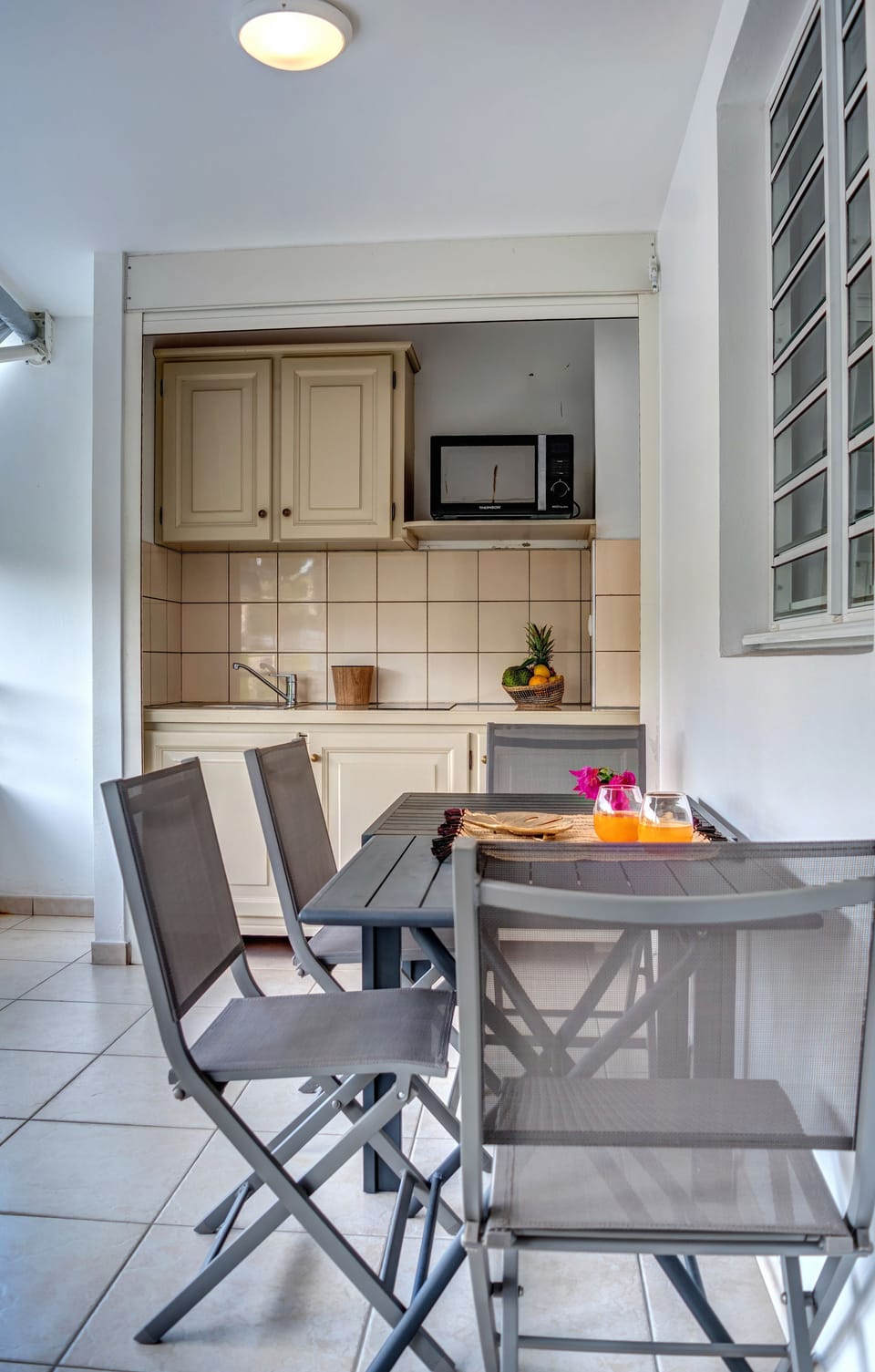 Luxury Suite, 1 Queen Bed | Private kitchenette | Full-size fridge, microwave, stovetop, highchair