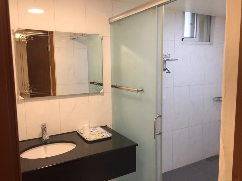 Shower, eco-friendly toiletries, hair dryer, slippers