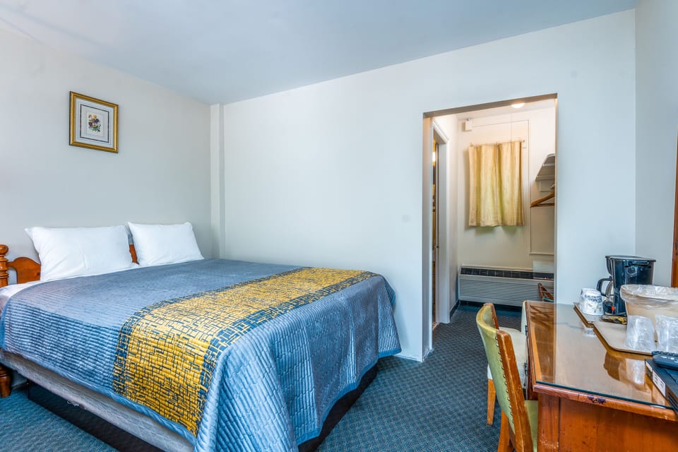 Basic Room, 1 Queen Bed, Mountain View | Desk, laptop workspace, blackout drapes, iron/ironing board