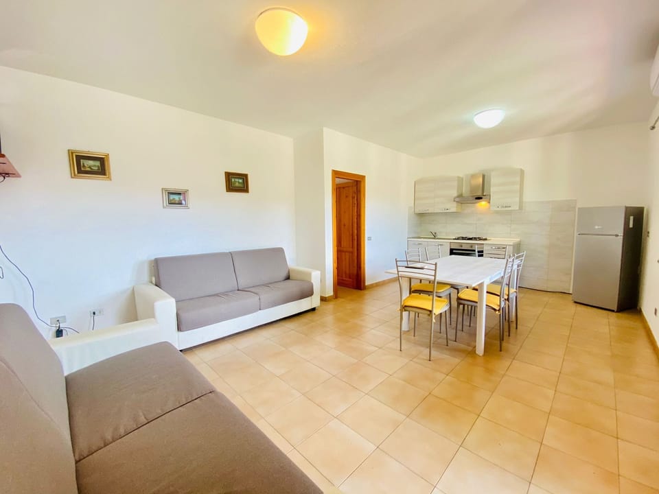 Apartment, 2 Bedrooms | Living area | 22-inch TV with digital channels