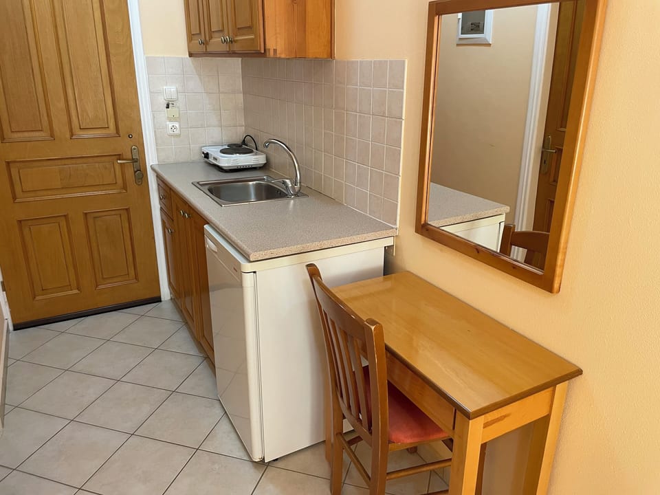 Twin Room, Sea View | Private kitchen | Fridge, electric kettle, dining tables
