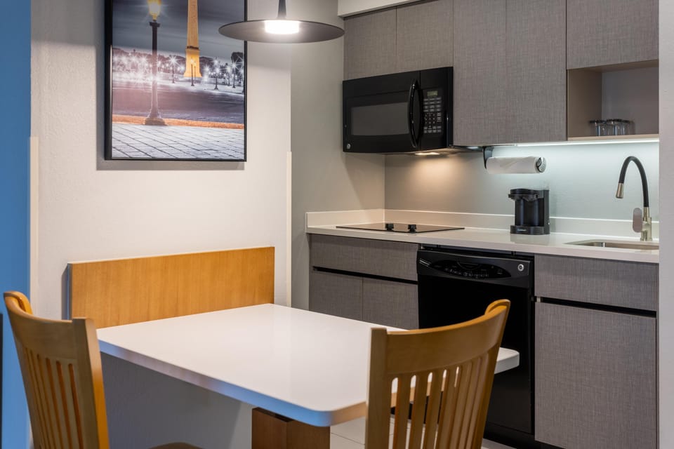 Studio Suite, 1 King Bed | Private kitchen | Fridge, microwave, stovetop, dishwasher