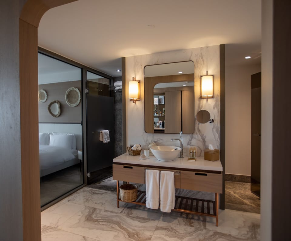 Shower, designer toiletries, hair dryer, bathrobes