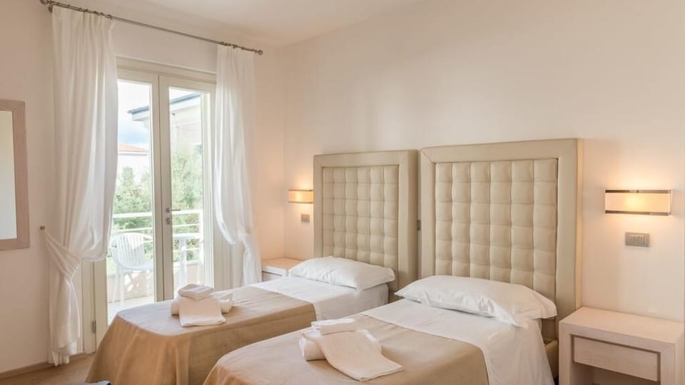 Quadruple Room | Minibar, in-room safe, desk, free WiFi