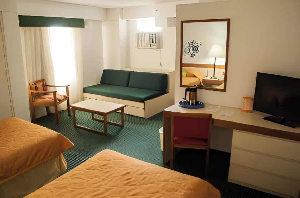 Family Studio Suite | In-room safe, desk, laptop workspace, blackout drapes