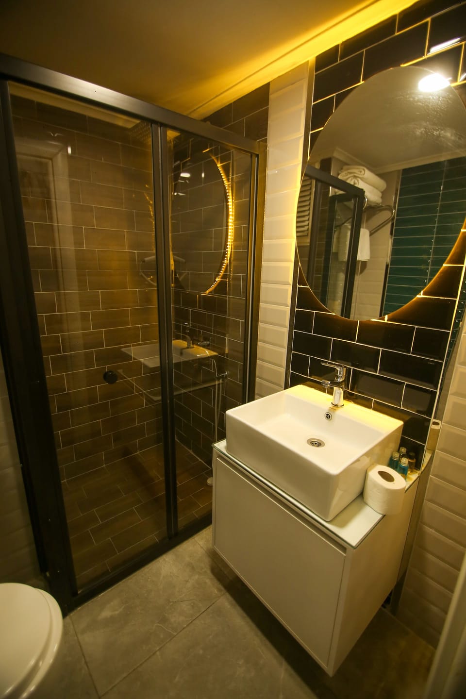 Shower, designer toiletries, hair dryer, slippers