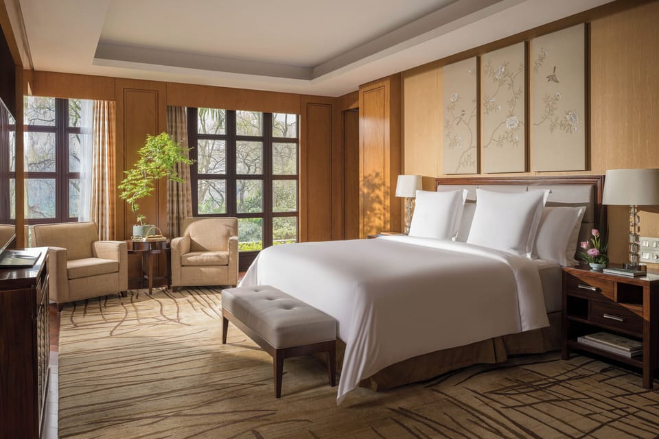 West Lake Suite | Hypo-allergenic bedding, down comforters, minibar, in-room safe