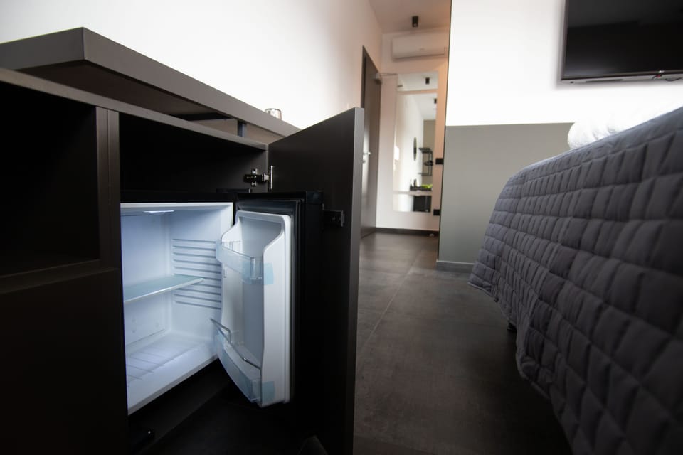 Luxury Triple Room, Multiple Beds, City View (1) | Minibar