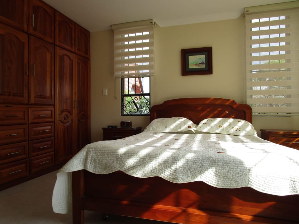 Premium bedding, down comforters, blackout drapes, iron/ironing board