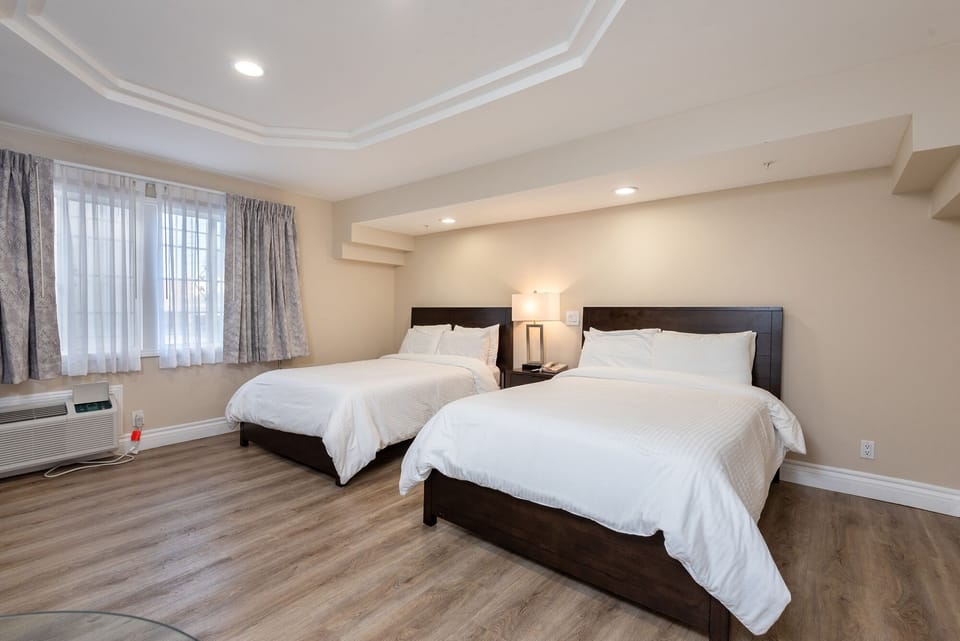 Deluxe Room, 2 Double Beds, Non Smoking | Iron/ironing board, cribs/infant beds, rollaway beds, free WiFi