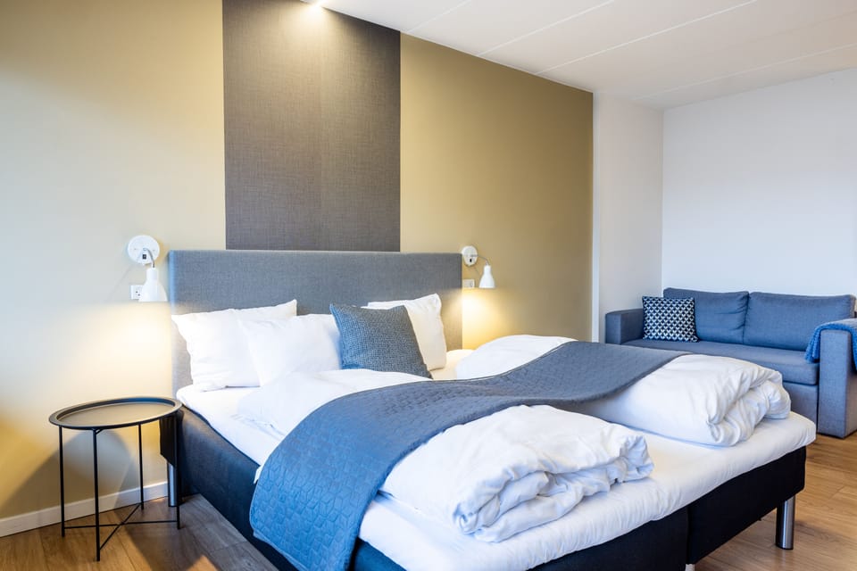 Deluxe Quadruple Room, Balcony | Individually decorated, individually furnished, desk, laptop workspace