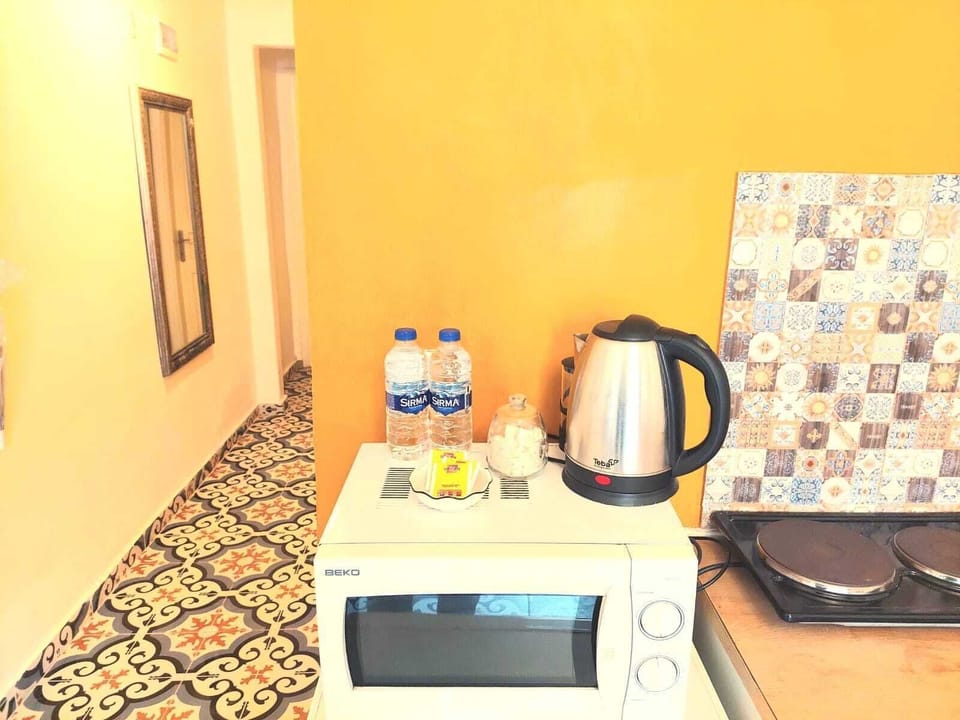 Deluxe Apartment | Private kitchen | Fridge, electric kettle, cookware/dishes/utensils, cleaning supplies