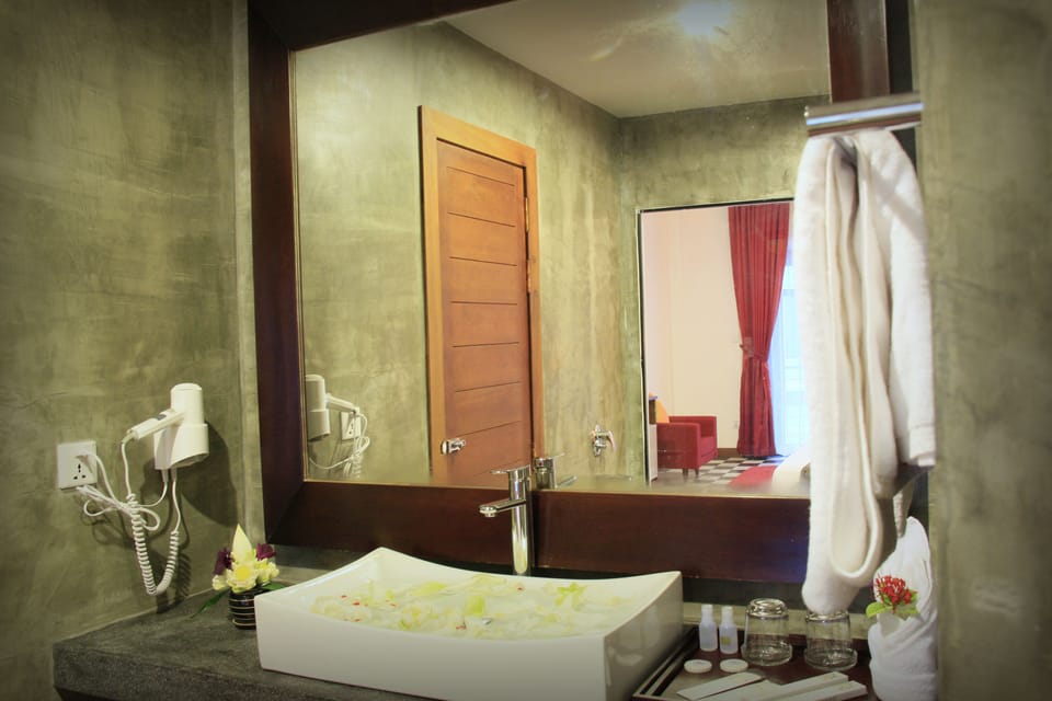 Shower, free toiletries, hair dryer, slippers