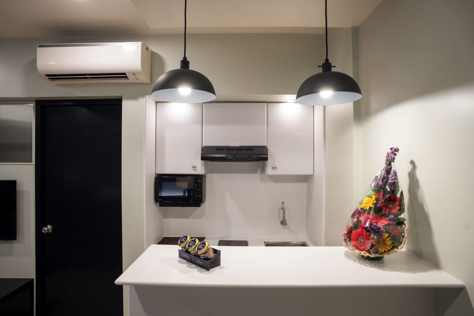 Suite Room | Private kitchen | Fridge, microwave, dishwasher, coffee/tea maker