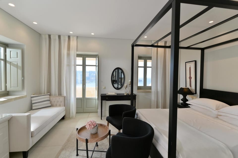 Suite, Sea View | Living area | 32-inch flat-screen TV with satellite channels, TV, books