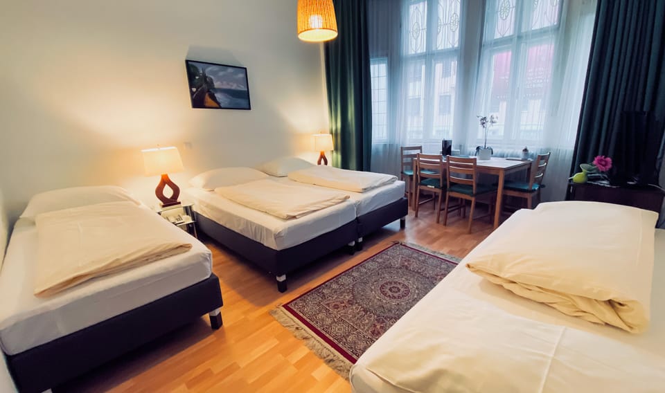 Quadruple Room | Select Comfort beds, in-room safe, desk, blackout drapes