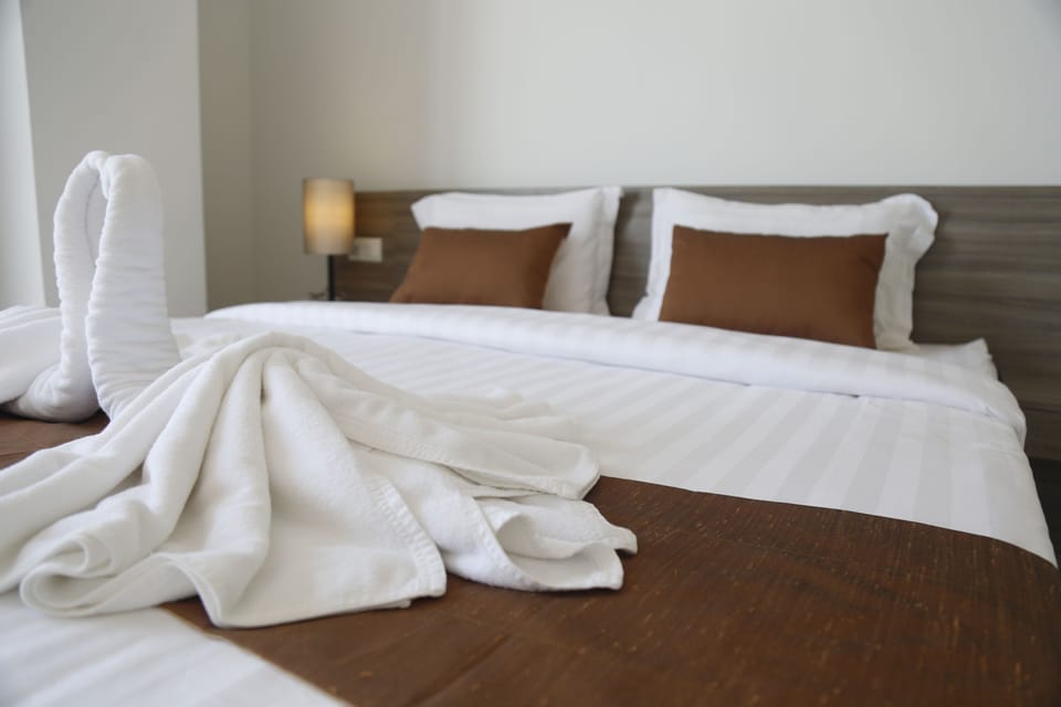 Down comforters, desk, blackout drapes, iron/ironing board