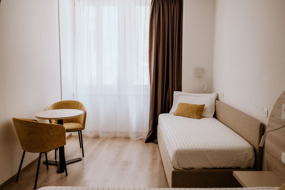 Comfort Quadruple Room, City View | Hypo-allergenic bedding, minibar, soundproofing, free WiFi