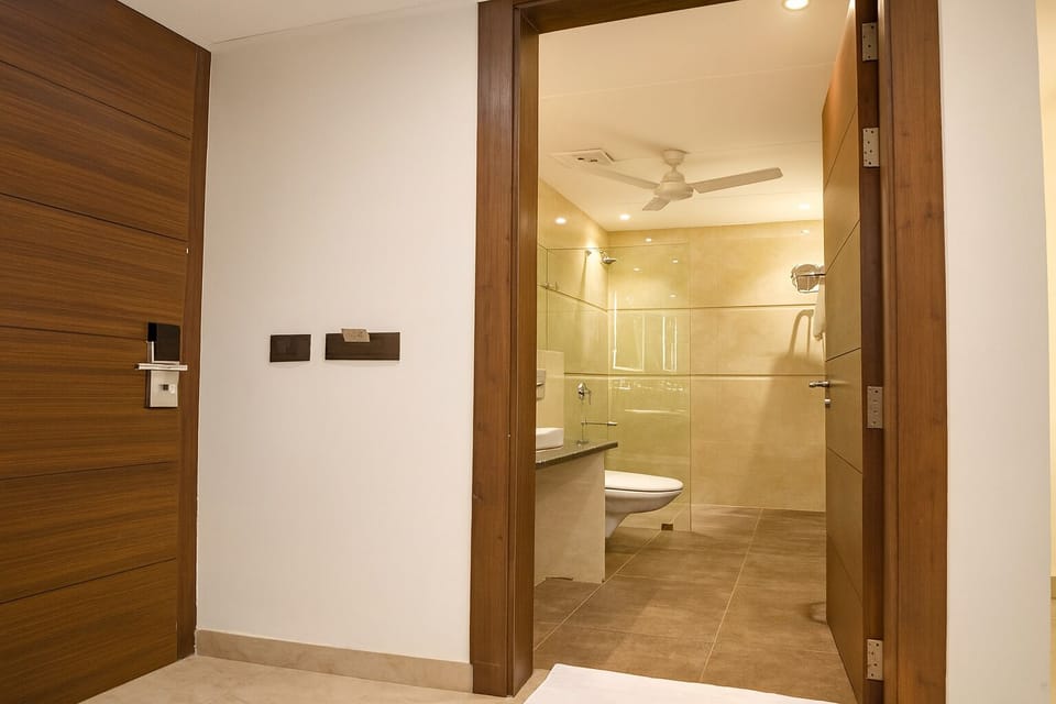 Shower, rainfall showerhead, towels, soap