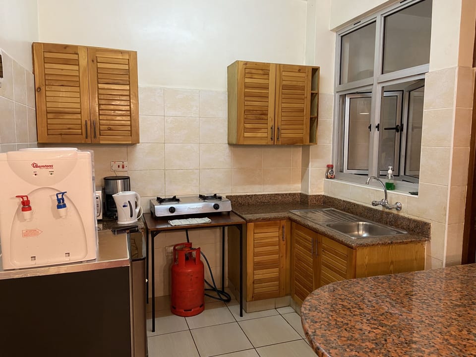 Classic Apartment, 2 Bedrooms | Private kitchen | Full-size fridge, microwave, stovetop, coffee/tea maker