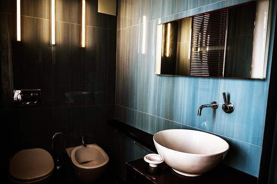 Quadruple Room | Bathroom | Shower, towels