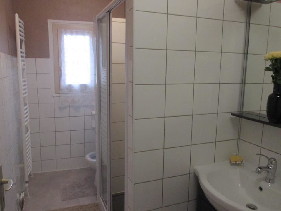 Shower, rainfall showerhead, hair dryer, towels