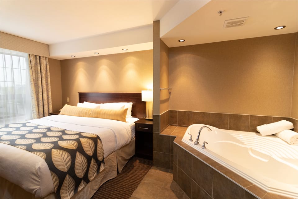 Suite, 1 King Bed, Jetted Tub | Premium bedding, pillowtop beds, desk, blackout drapes