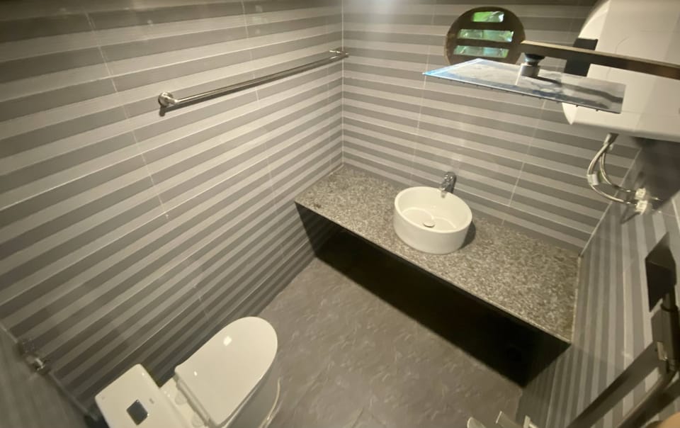 Basic Shared Dormitory, Mixed Dorm, Lake View | Bathroom | Shower, hydromassage showerhead, designer toiletries, hair dryer