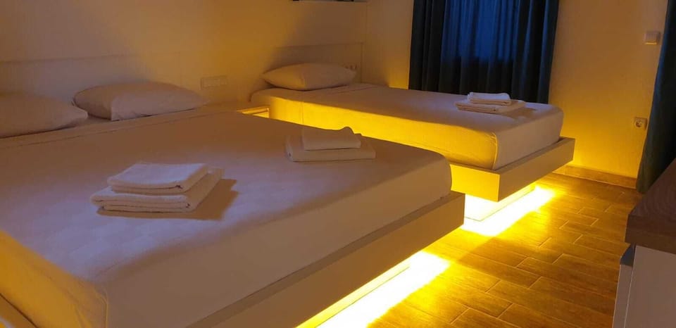 Economy Triple Room | Minibar, iron/ironing board, free WiFi, bed sheets