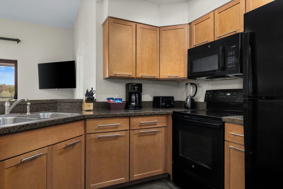Fridge, microwave, stovetop, coffee/tea maker