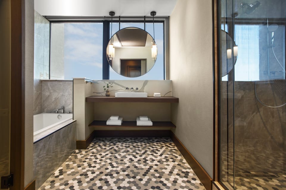 Designer toiletries, hair dryer, bathrobes, slippers