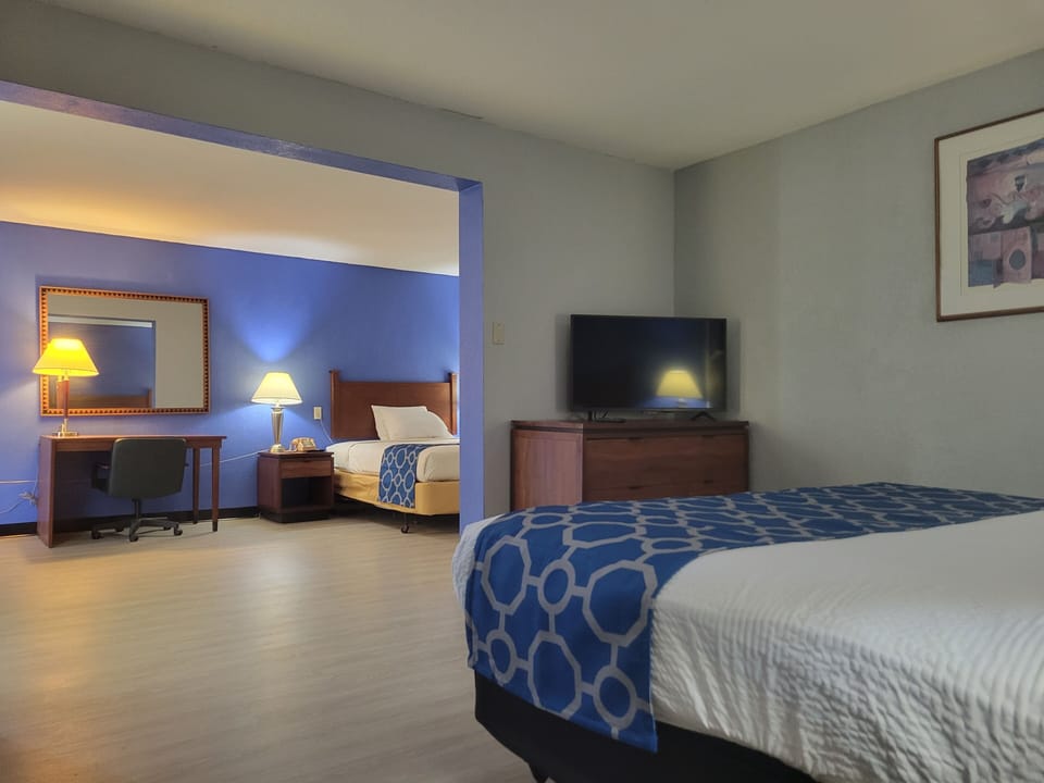 Deluxe Studio Suite, Multiple Beds, Non Smoking | Desk, laptop workspace, iron/ironing board, free WiFi