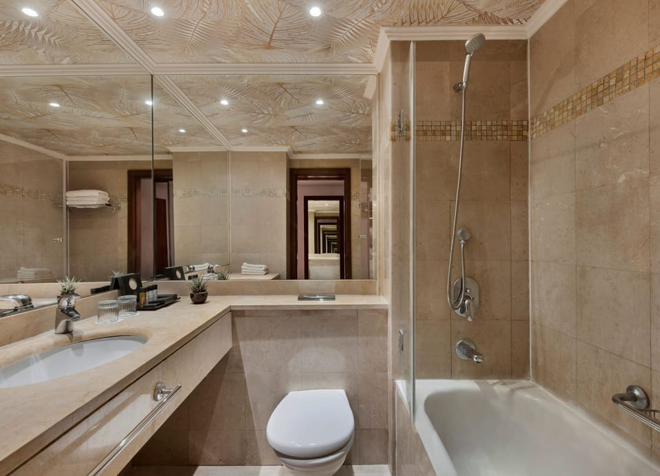 Bathtub, hair dryer, towels