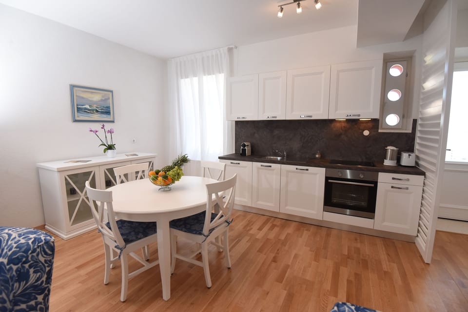 Comfort Apartment, Sea View | Private kitchen | Full-size fridge, stovetop, coffee/tea maker, electric kettle