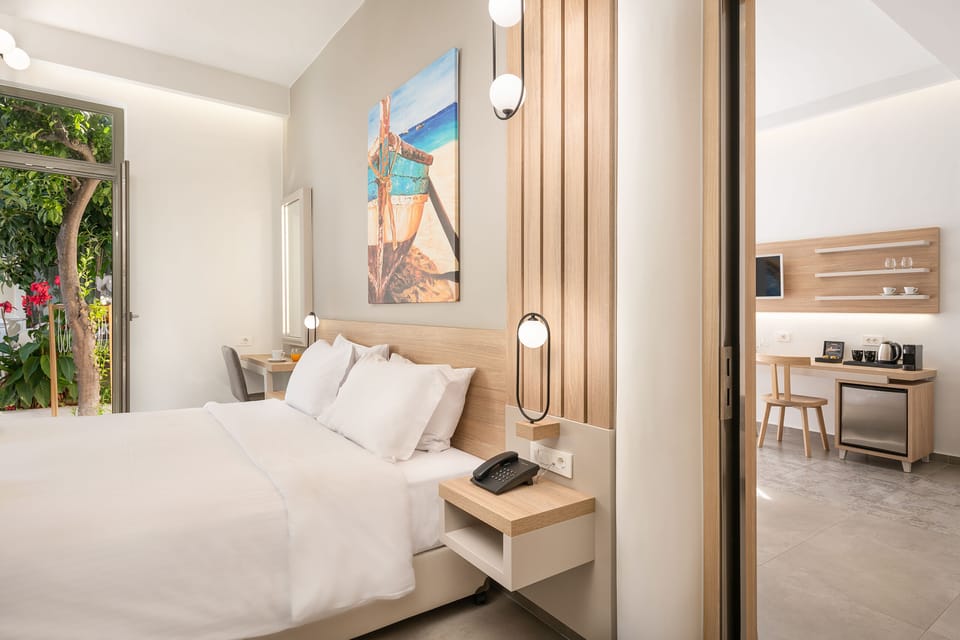 Apartment, Garden View | Minibar, in-room safe, desk, laptop workspace