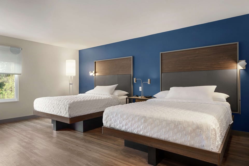 Desk, laptop workspace, blackout drapes, iron/ironing board